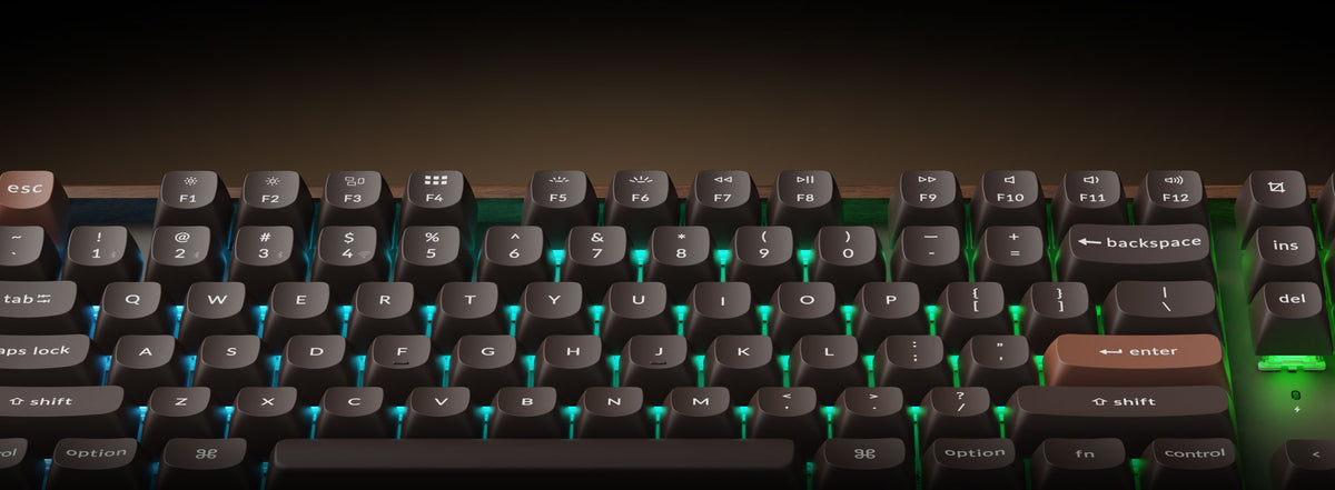 K8 HE All-Wood Edition with blue and green backlighting glowing between the keycaps.