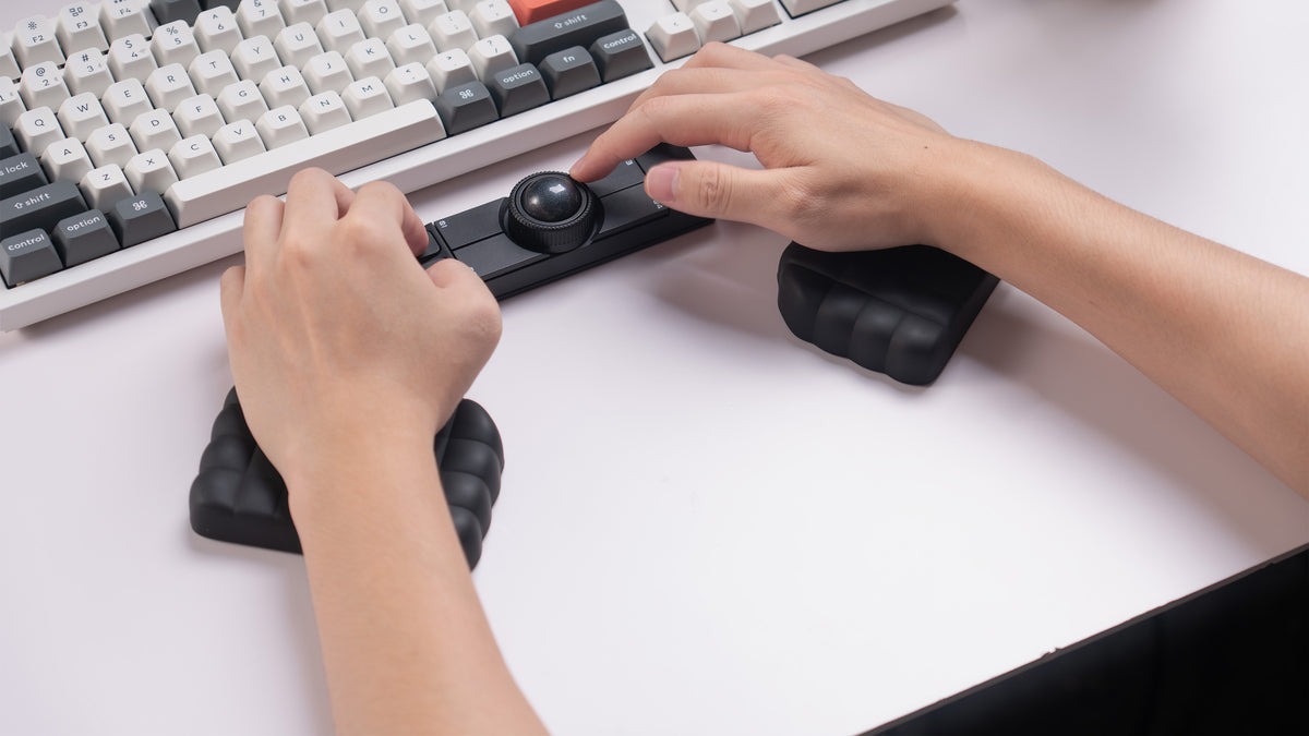 A dedicated palm rest for Nape Pro, crafted with a soft-touch silicone surface and split adjustable design to provide natural hand support, flexible positioning, and lasting comfort during extended trackball sessions. Its versatile shape also complements a wide range of desktop setups beyond Nape Pro.*Note: Only one pair of palm rests is included. Nape Pro and the keyboard are not included.